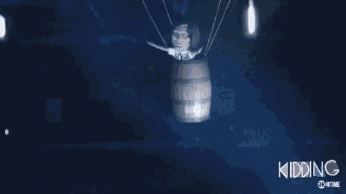 a cartoon character is flying in a barrel in a hot air balloon ..