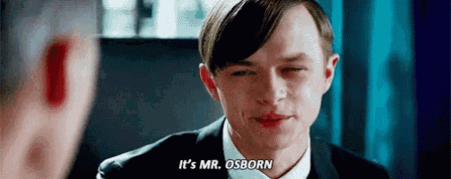 a man in a suit and tie is talking to another man and saying `` it 's mr . osborn '' .