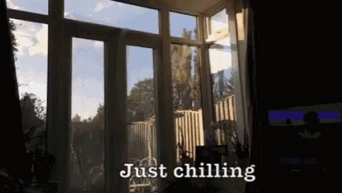 a room with lots of windows and the words just chilling