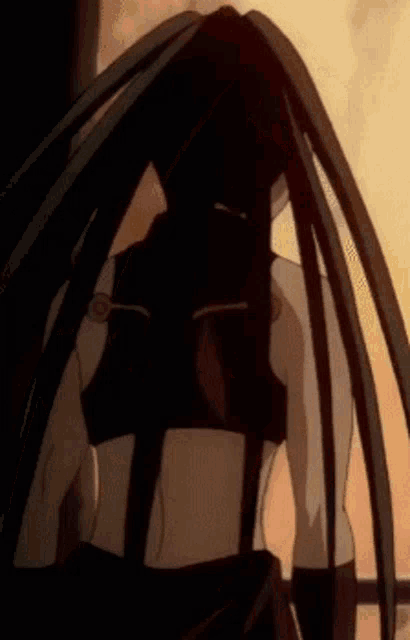 a close up of a person 's back with very long hair