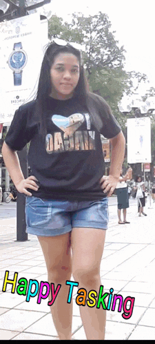 a woman wearing a shirt that says happy tasking on it