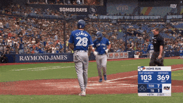 a baseball player with the number 28 on the back of his shirt