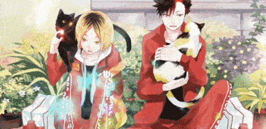 a man in a red jacket is holding a cat and a black cat