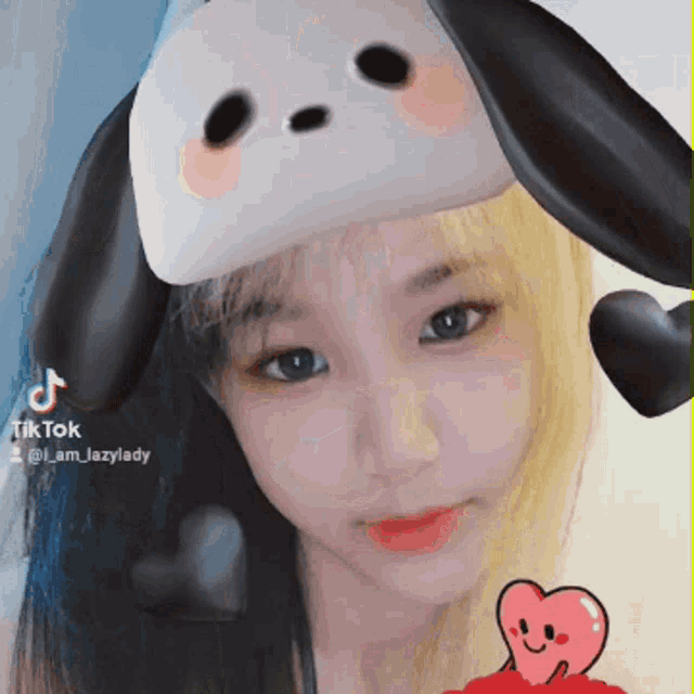 a girl is wearing a mask with a dog face on it and the hashtag tik tok