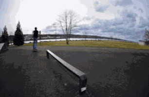 a person riding a skateboard down a ramp with a sticker on it that says ' skateboard '