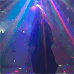 a blurry picture of a person dancing in a club