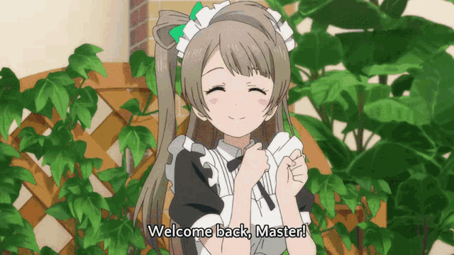 a maid says welcome back master in front of a plant