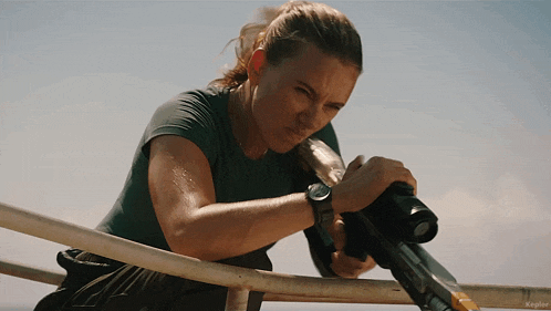 a woman holding a gun with the word kepler on the bottom right