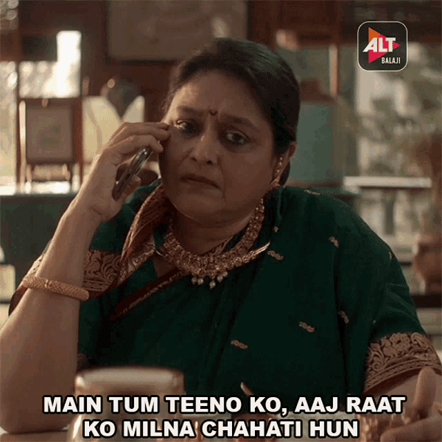a woman is talking on a cell phone with the alt balaji logo behind her