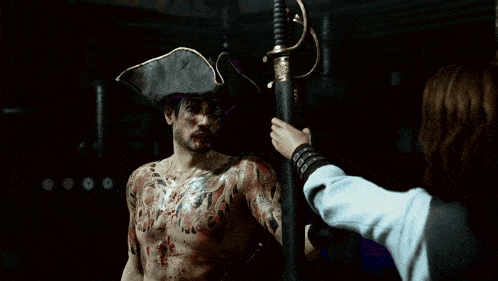a man with a tattoo on his back holding two swords