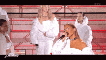 a woman singing into a microphone with the words star academy on the bottom left