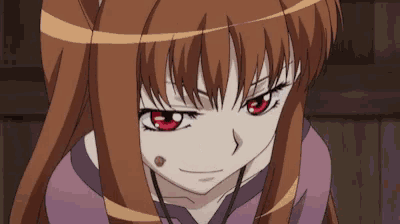 a close up of a girl with red eyes looking at the camera