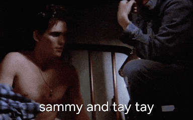 a shirtless man is talking to another shirtless man with the words sammy and tay tay