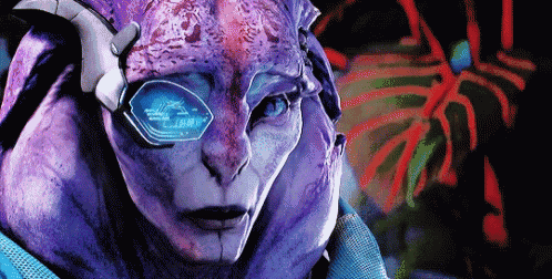 a close up of a purple alien 's face with blue eyes