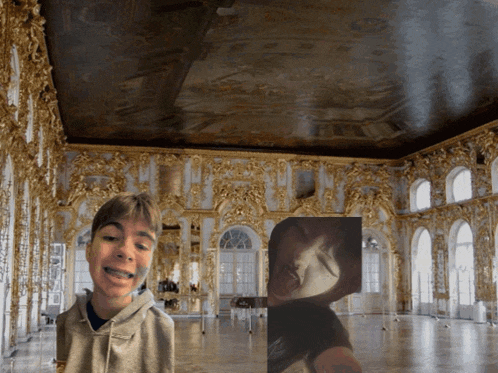 a boy with braces on his teeth is standing in front of a large room