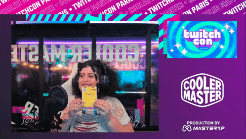a woman is holding a card in front of a screen that says cooler master
