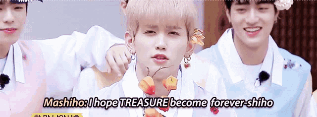 a group of young men are standing next to each other with the words mashiho i hope treasure become forever shiho