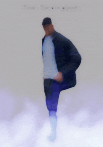 a man in a black jacket is standing in a cloud of smoke with the words the strongest above him