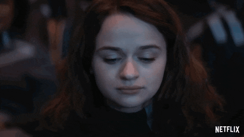 a close up of a woman 's face with a netflix logo in the corner