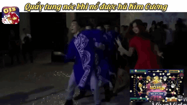 a group of people dancing in front of a screen that says gis
