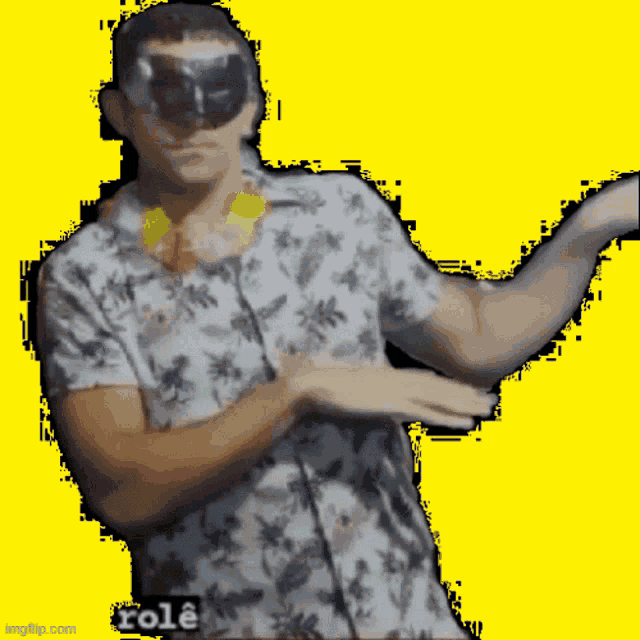 a man wearing sunglasses and a hawaiian shirt has the word role written on the bottom right