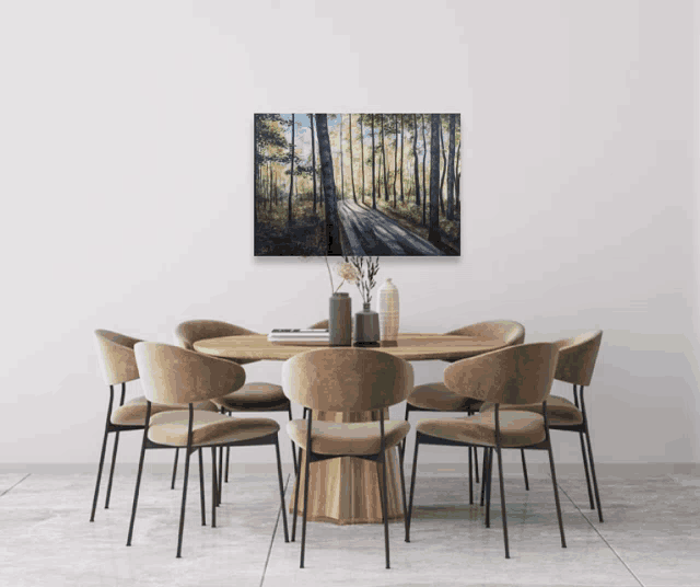 a dining room with a table and chairs and a painting on the wall above the table
