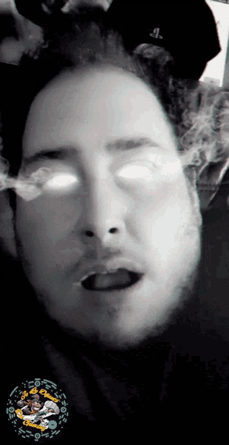 a man with smoke coming out of his eyes and a playstation logo in the background