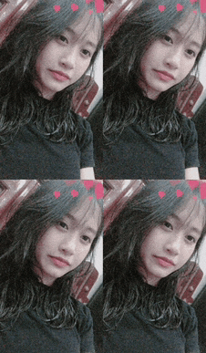 a girl in a black shirt with hearts on her face