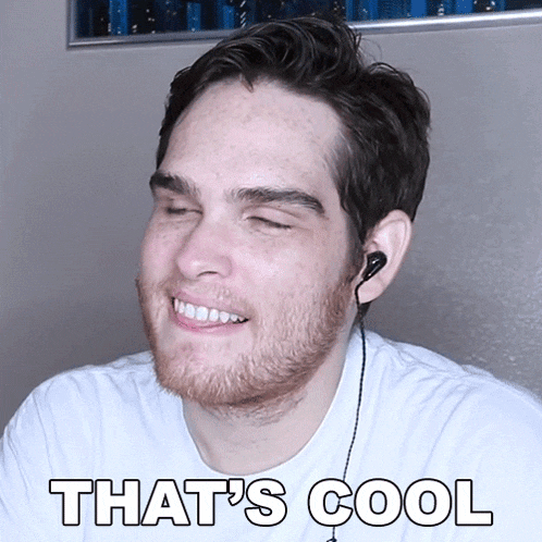 a man with a beard and ear buds smiles with the words that 's cool below him