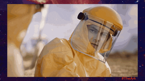 a picture of a man in a protective suit with #theark in red
