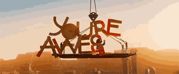 a lego sign that says you 're awesome is being lifted by a crane