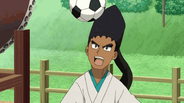 a man with a soccer ball on his head