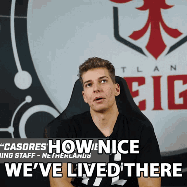 a man sitting in front of a sign that says ' we 've lived there '