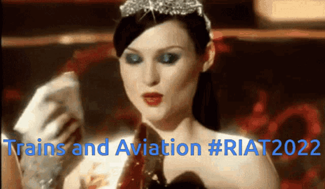 a woman wearing a tiara and gloves with the words trains and aviation