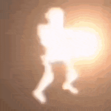 a silhouette of a person walking in the dark