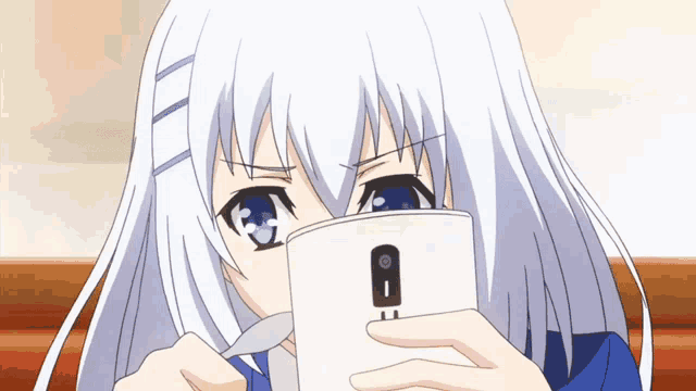 a girl with white hair and blue eyes looks at a cell phone
