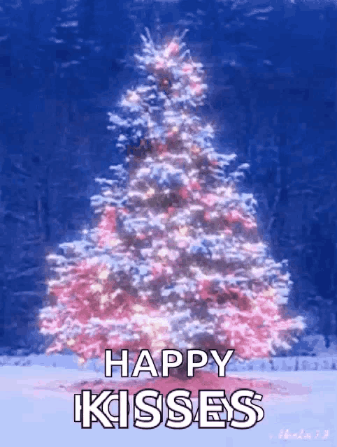 a pink and white christmas tree with the words happy kisses below it