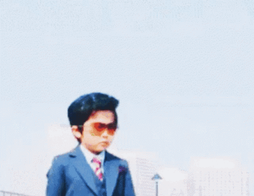 Cool Shades Off GIF - Cool Shades Off Kid In A Suit GIFs
