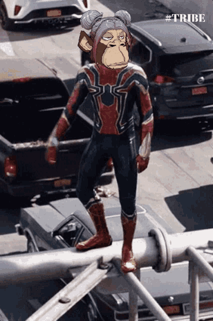 a monkey in a spiderman suit is standing on a railing