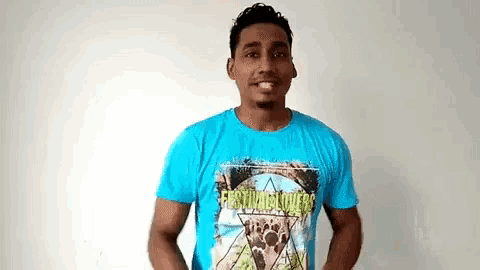 a man wearing a blue t-shirt that says festival lovers on it