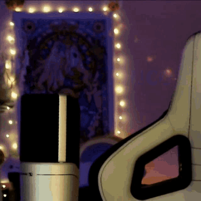 a white chair is in front of a purple wall