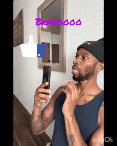 a man taking a picture of himself in front of a mirror with bravooo written on the top