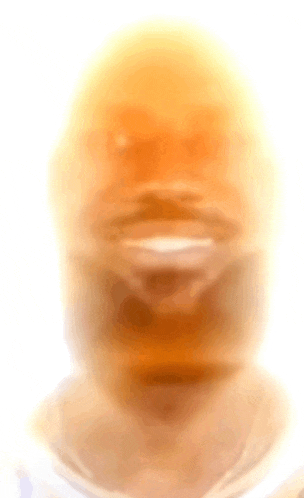 a blurry picture of a person 's face with a beard