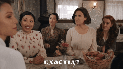 a group of women sitting around a table with the word exactly written on the bottom