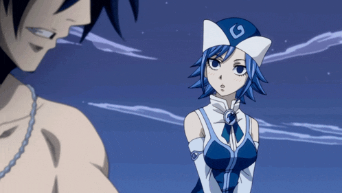 a man and a girl are standing next to each other and the girl is wearing a hat with the letter g on it