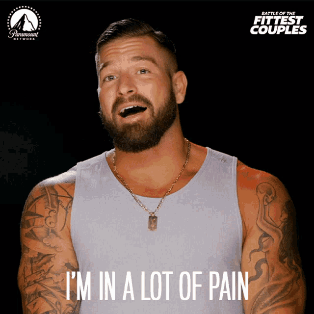 a poster for battle of the fittest couples shows a man with a beard and tattoos