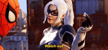 a woman in a superhero costume is standing next to a spider man and asking him to watch out .