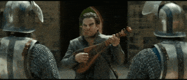 a man in armor is playing a guitar in front of a group of knights