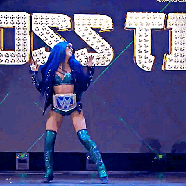 a woman with blue hair is dancing in front of a sign that says ost