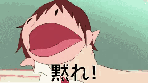 a cartoon character with a big mouth is being held by a hand in a foreign language .